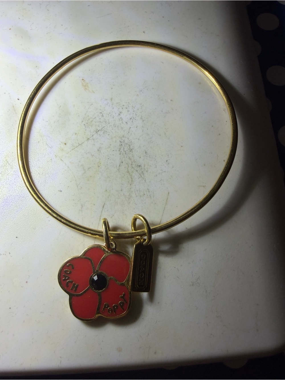 Coach EUC Gold Tone Bangle with Red Poppy Charm